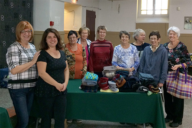 Remise de plusieurs pièces au Carrefour d'entraide.
